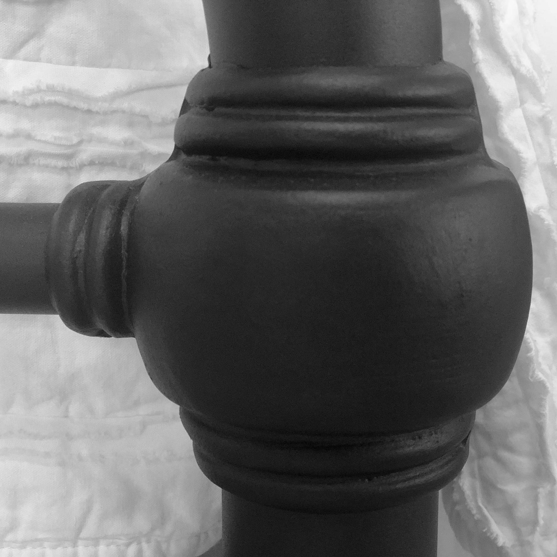 Iron bed casting closeup of the 20th c Americana Iron Bed in Matte Black. Authentic hand-poured castings manufacturer high-end luxury iron furniture.